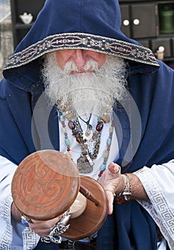 Fortune teller looking hour glass