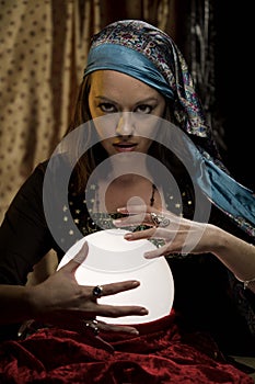 Fortune teller psychic gypsy at crystal ball