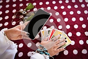 Fortune teller reading fortune lines on screen smartphone modern horoscopes online fortune telling application Palmistry Psychic