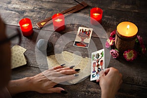 Fortune teller reading a future by tarot cards