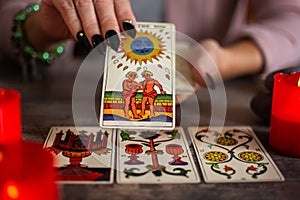 Fortune teller reading a future by tarot cards