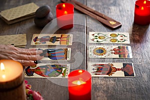 Fortune teller reading a future by tarot cards