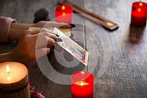 Fortune teller reading a future by tarot cards