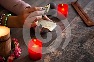 Fortune teller reading a future by tarot cards