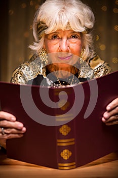 Fortune teller reading magic book