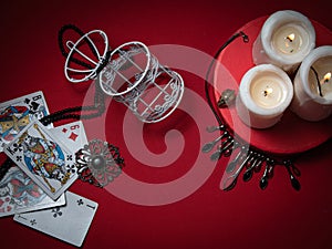 Fortune teller`s table. Playing cards, candles, jewelry.  The concept of magic and occultism.