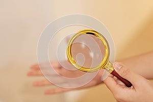 Fortune Teller uses a golden magnifying glass to see his horoscope