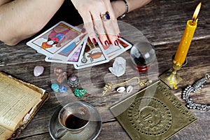 Fortune teller woman predicting future from cards photo