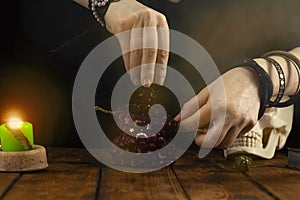 Fortuneteller`s hands. The fortune teller opens a bag of herbs, a magic potion. Psychic readings and the concept of clairvoyance