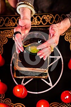 Fortuneteller during Seance with crystal ball