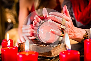 Fortuneteller during Seance with crystal ball