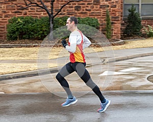 Forty-three year old man running the Edmond Turkey Trot on Thanksgiving in Edmond, Oklahoma