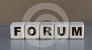 FORUM word on cubes on a beautiful coffee background