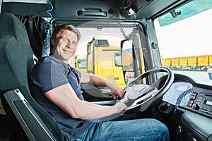 Forwarder or truck driver in drivers cap