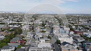 Forwards fly above streets and buildings in residential urban borough. Suburb of metropolis. Los Angeles, California