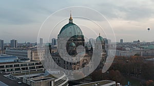 Forwards and tilt down revealing of historic building of evangelic church Berliner Dom, Berlin Cathedral. Overcast sky