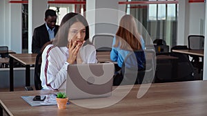 Forworn employee in open space office