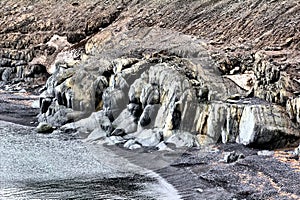 Fossilized dinosaurs. The shore of the Barents sea and abrasion. Arctic