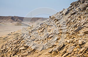 Fossilized seashells in the desert. A hill of fossilized seashel