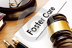 Foster care. Documents and gavel on a desk. photo
