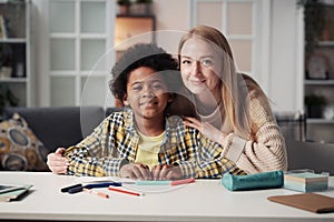 Foster mother with her adoptive son at home