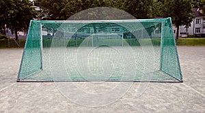 Fotball nett standing on playground photo