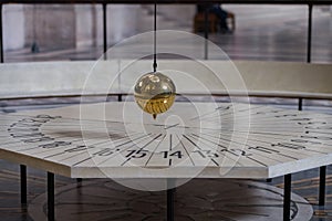 Foucault pendulum inside Paris Pantheon photo