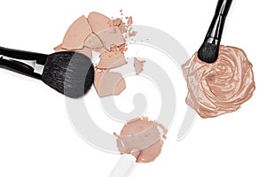 Foundation, concealer and powder with makeup brushes