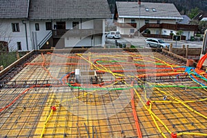 Foundation construction with colorful plastic tubes and iron rods
