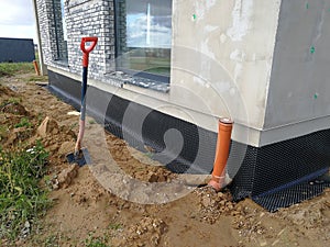 Foundation drainage preparation in construction site
