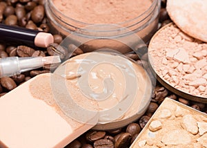 Foundation makeup products on coffee beans