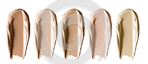 Foundation makeup swatch smear smudge set. Beige brown cosmetic cream concealer strokes isolated on white