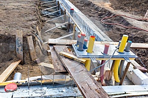 Foundation with pipes on construction site