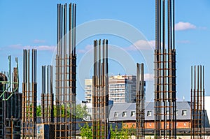 The foundation on reinforced concrete piles and the frame during the construction of a multi-storey building