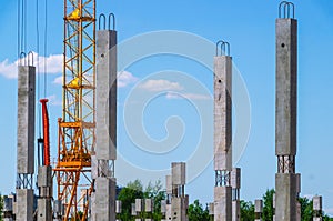 The foundation on reinforced concrete piles and the frame during the construction of a multi-storey building
