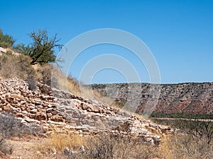 Foundations of ancestral pueblo dwelling at Tuzigoot National Monument in Arizona photo
