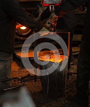 Foundry ladle with molten metal in workshop of metallurgical plant