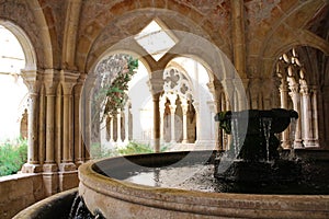 Fountain for ablutions and carved arches of the ancient monastery of Poblet cat. Reial Monestir de