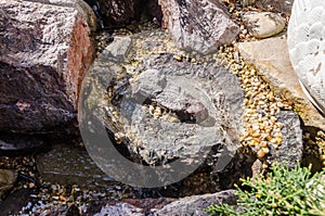 Fountain as garden decor from stones