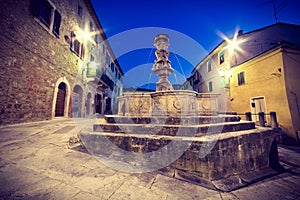 Fountain in Asciano, Tuscany photo