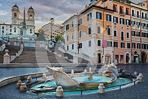Fountain of Boat and Spanish steps with Trinita dei Monti church in Rome photo