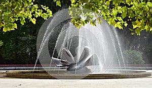 Fountain in bright sunlight in park