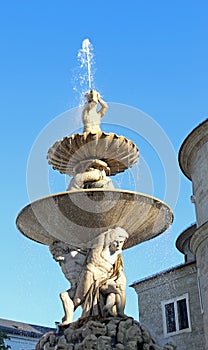 Fountain called residenzbrunnen in Salzburg in Austria photo