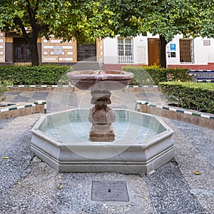 Fountain in the center of the Dona Elvira Square in the Barrio de Santa Cruz in Seville, Spain. photo