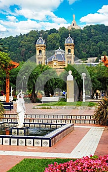 Fountain on the central square in San Sebastian, Donostia, Spain and mount Urgull
