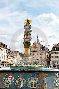 Fountain with column of virgin mary with aureola and Child Jesus, Schwaebisch Gmuend, Germany