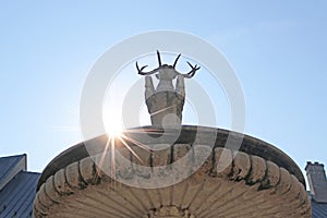 The fountain with deer armorial symbol of genus Palffys in the courtyard of castle Red Stone, Casta, Slovakia