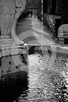 Fountain detail with a little water falling, black and white