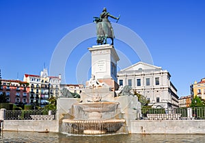 Fountain on Eastern square Plaza de Oriente with Royal theatre Teatro Real at background, Madrid, Spain photo