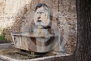 Fountain at the entrance of the Orange Trees Garden in Rome, Italy